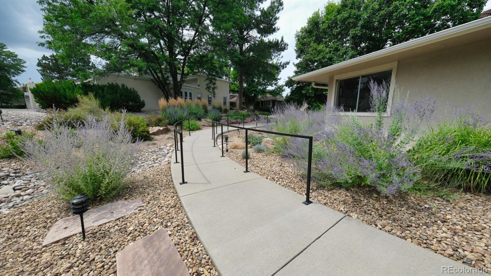 3292 South Oneida Way Denver, CO 80224 - Photo 42 of 44 a view of a chairs and table in the backyard