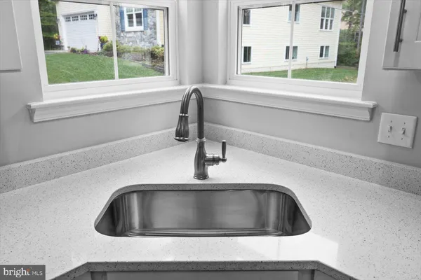 a bathroom with a sink and a window