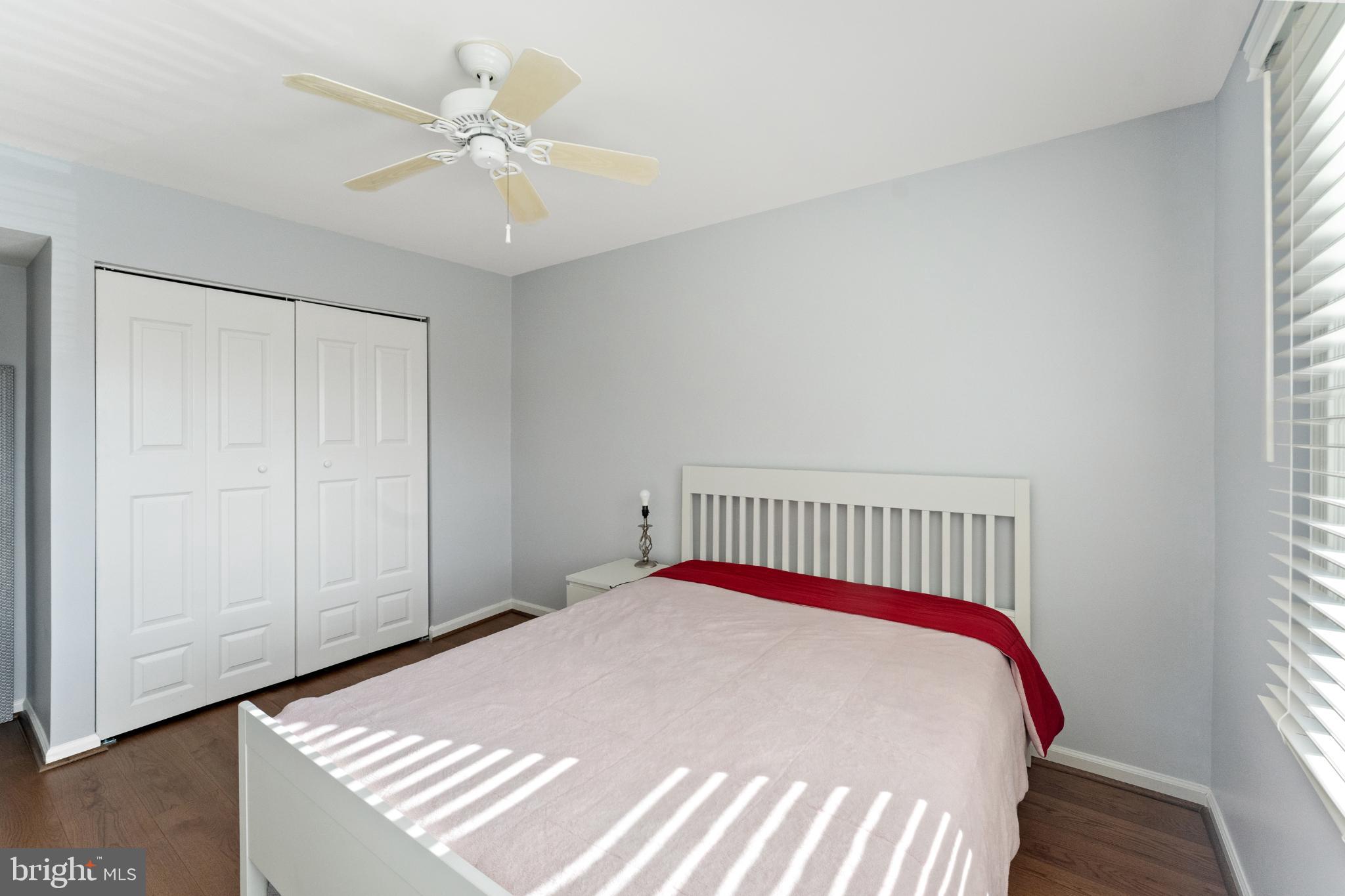 11 Briarstone Lane Gaithersburg, MD 20877 - Photo 16 of 31 a bedroom with a bed and a chandelier