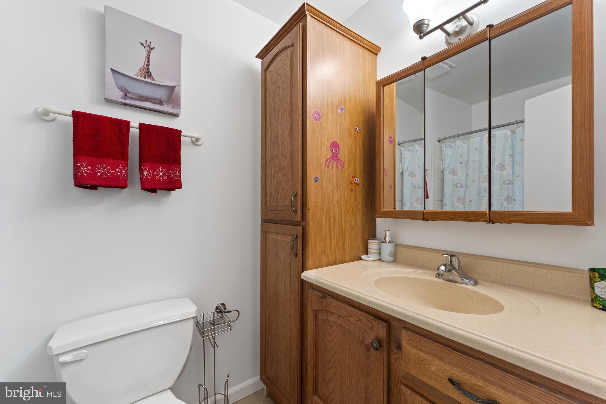 11 Briarstone Lane Gaithersburg, MD 20877 - Photo 17 of 31 a bathroom with a granite countertop sink mirror vanity and toilet