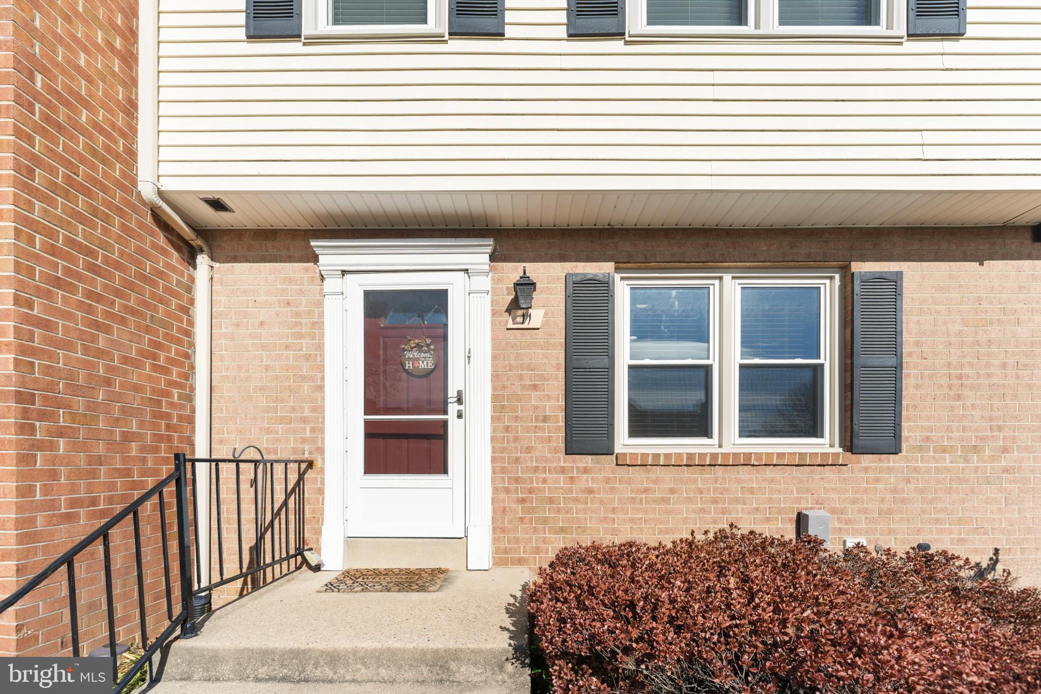 11 Briarstone Lane Gaithersburg, MD 20877 - Photo 2 of 31 a side view of a house with a large window