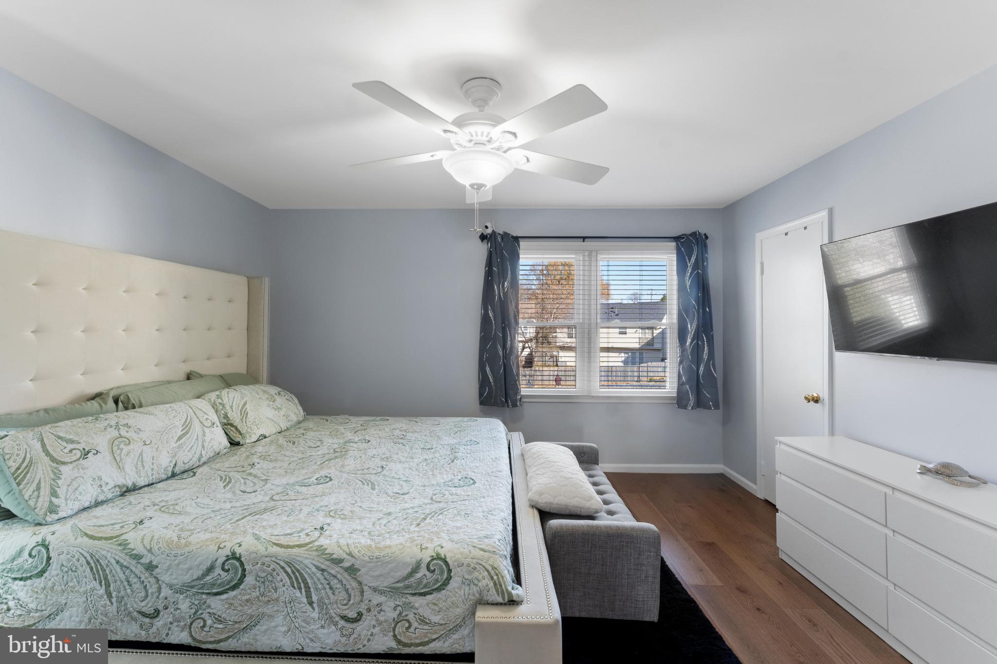 11 Briarstone Lane Gaithersburg, MD 20877 - Photo 21 of 31 a bedroom with a large bed and a flat screen tv