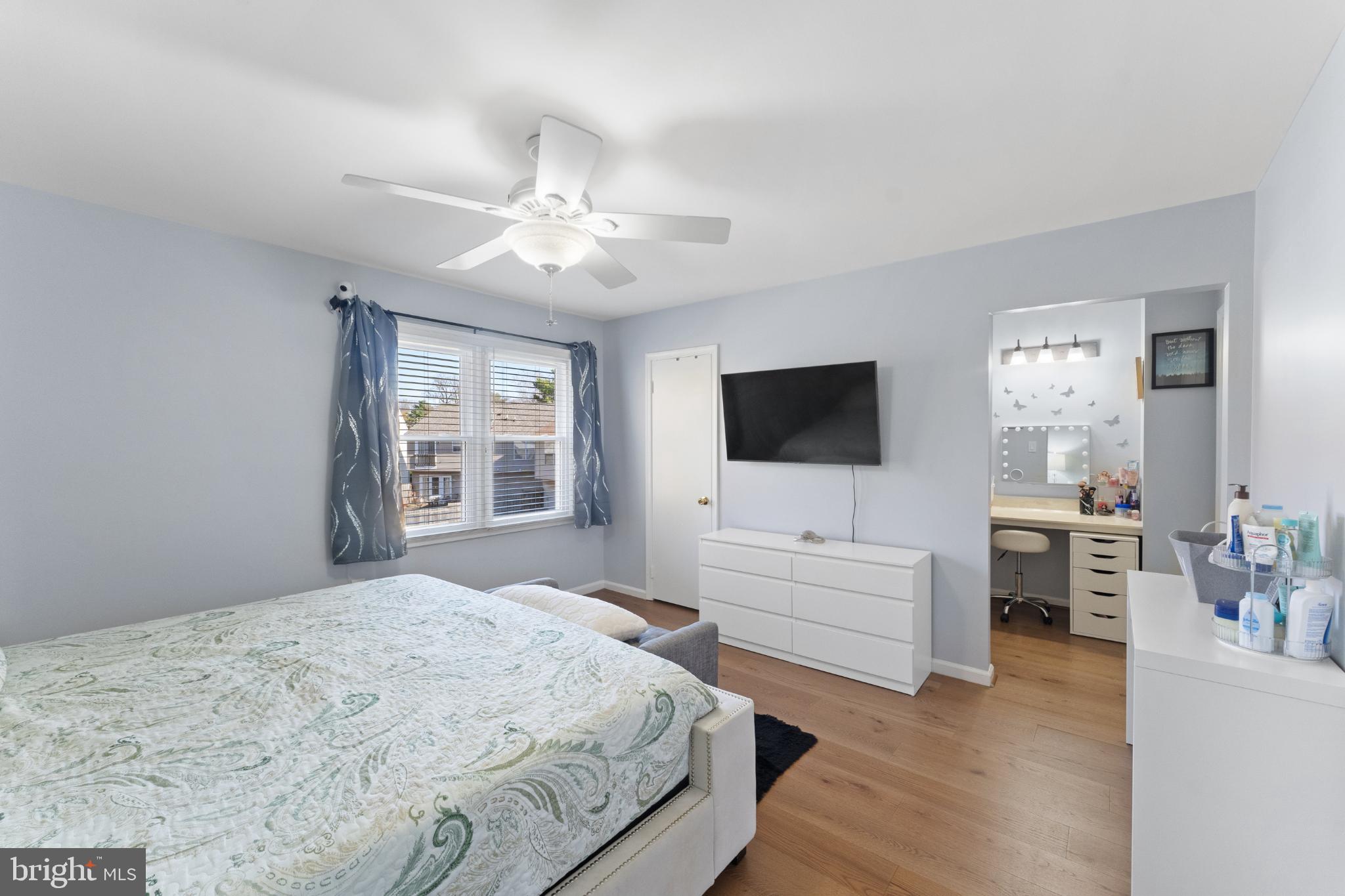 11 Briarstone Lane Gaithersburg, MD 20877 - Photo 22 of 31 a bedroom with a bed and a flat screen tv