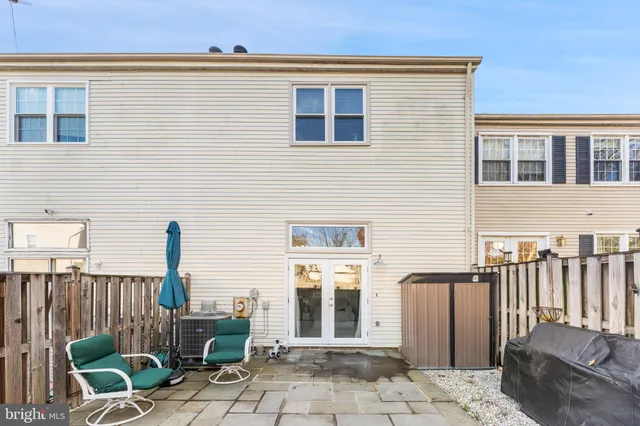 a front view of a house with outdoor seating