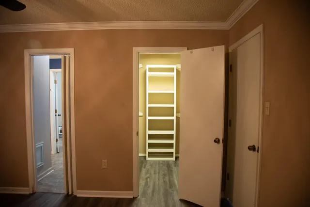 a view of a patio with a table chairs and a swimming pool