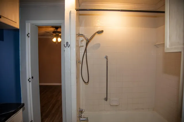 a bathroom with a glass shower door