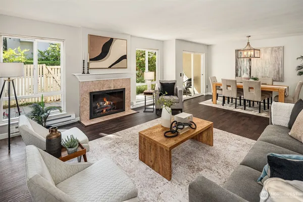 a living room with furniture and a fireplace