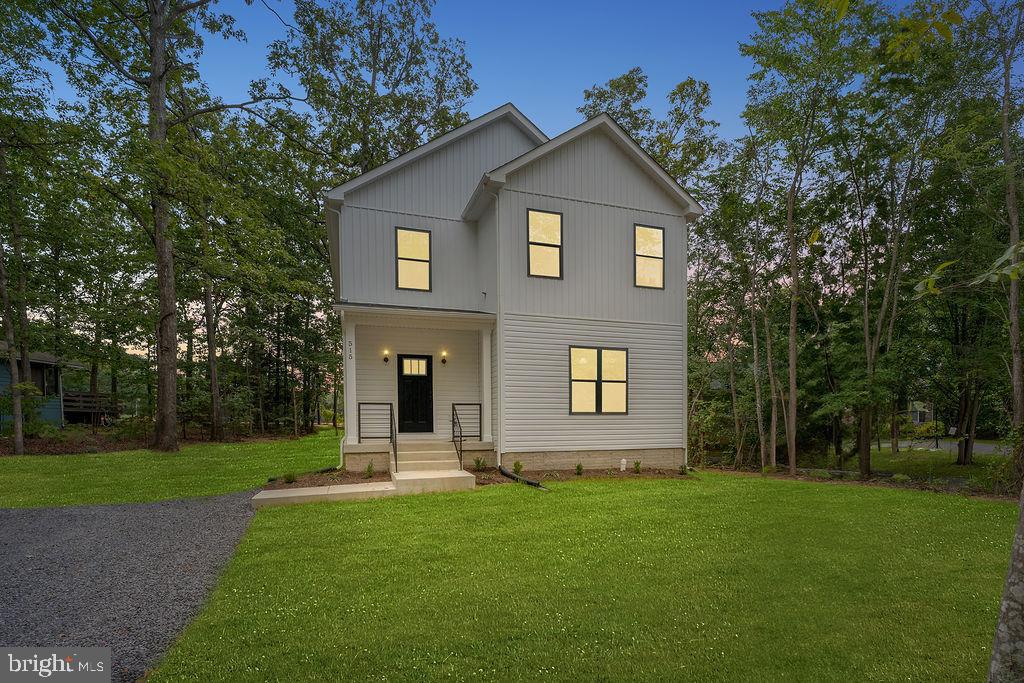 a front view of a house with a yard