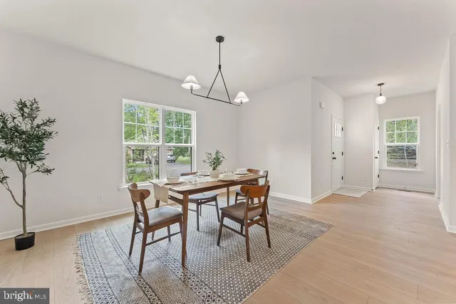 a bathroom with a toilet a sink and a mirror