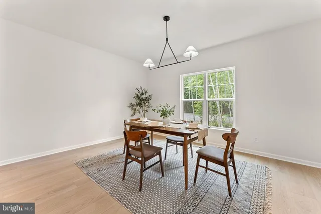 a bathroom with a toilet a sink and a mirror