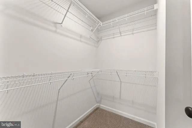 a bathroom with a sink a vanity and shower