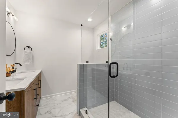 a bathroom with a shower and a sink
