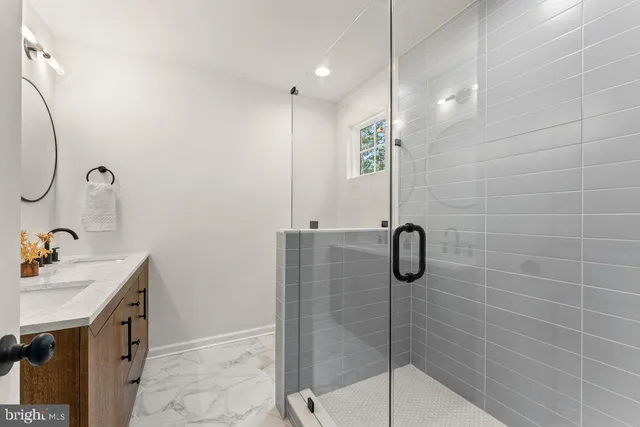 a bathroom with a shower and a sink