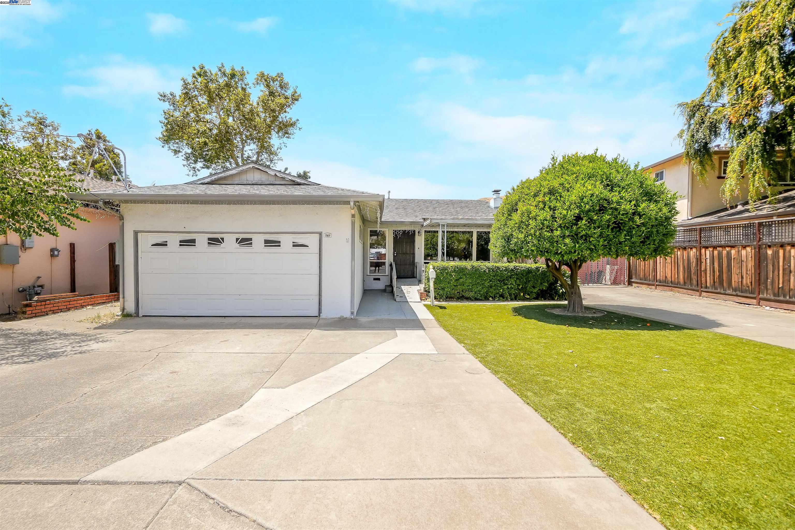 745 Wasatch Drive Fremont, CA 94536 - Photo 1 of 1 a front view of a house with a yard and garage