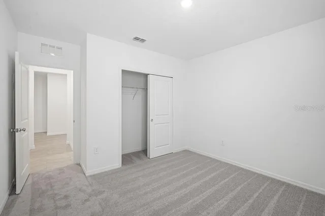 an empty room with wooden floor