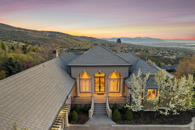 1714 Ridge Point Drive Bountiful, UT 84010 - Photo 129 of 132 Stucco exterior with a tile roof, double-door entryway, and mature landscaping