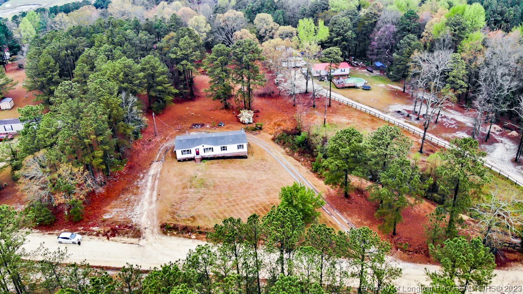 243 Hollywood Road Cameron, NC 28326 - Photo 1 of 39 an aerial view of residential houses with outdoor space and trees all around