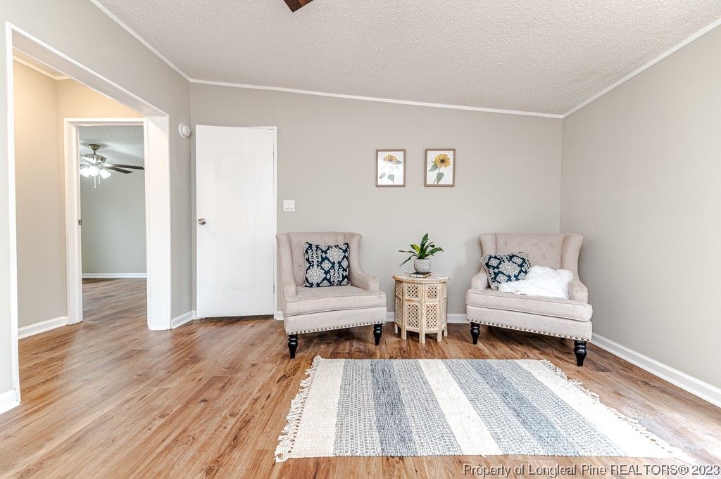 243 Hollywood Road Cameron, NC 28326 - Photo 35 of 39 a living room with furniture and wooden floor