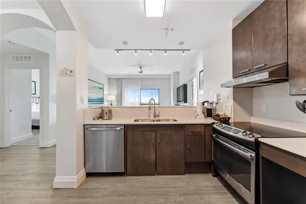 a kitchen with a sink and cabinets