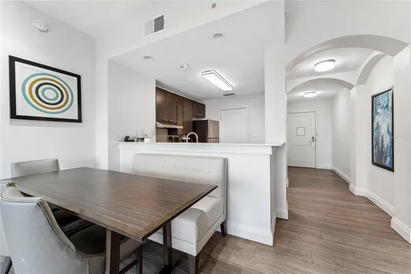 a view of kitchen island with furniture and wooden floor