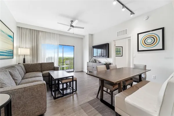 a living room with furniture and a window