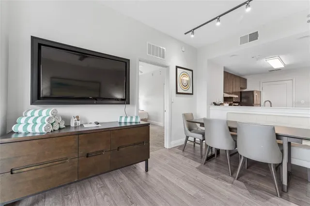 a kitchen with stainless steel appliances a sink and cabinets