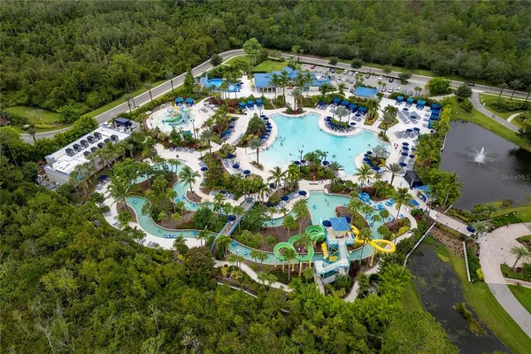 an aerial view of residential houses with outdoor space and street view