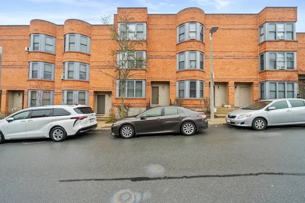 a car parked in front of a house