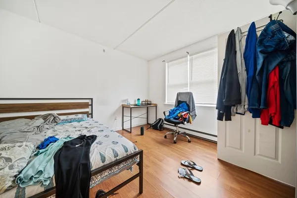 a bed room with a bed and a view of walk in closet