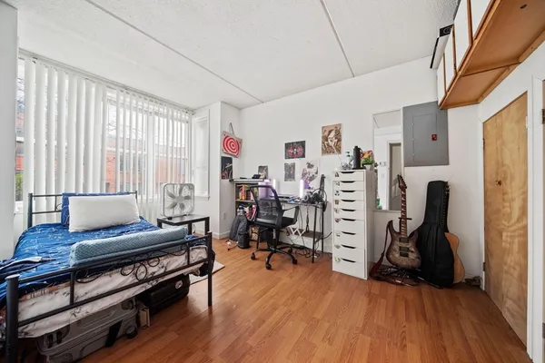 a view of a livingroom with furniture and a window