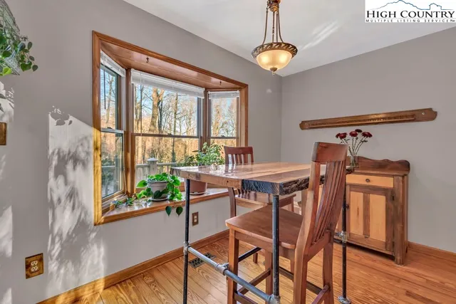 a view of a kitchen with kitchen island a sink appliances and a counter top space