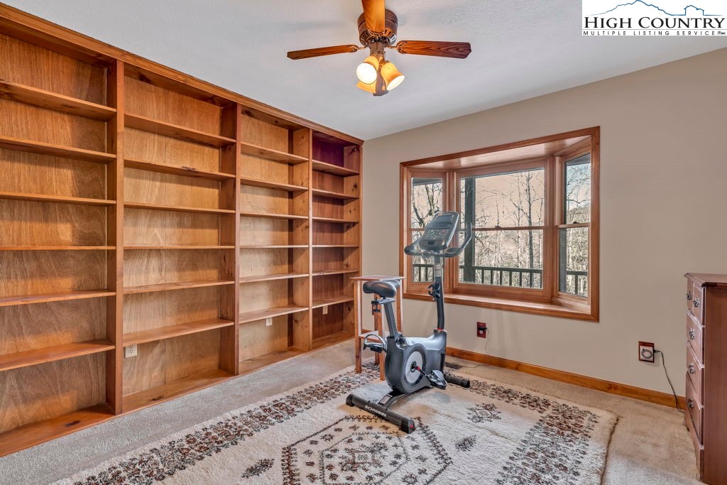 472 Virgil's Lane Boone, NC 28607 - Photo 19 of 44 a workspace with wooden floor and a window