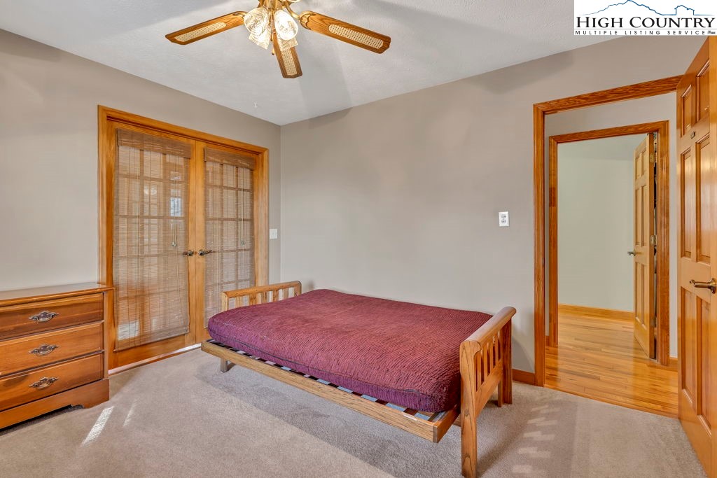472 Virgil's Lane Boone, NC 28607 - Photo 23 of 44 a bedroom with a bed and a window