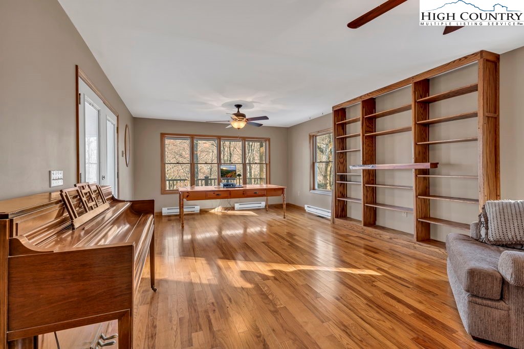 472 Virgil's Lane Boone, NC 28607 - Photo 29 of 44 a view of living room with furniture and floor to ceiling window
