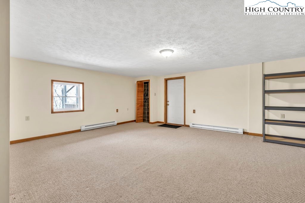 472 Virgil's Lane Boone, NC 28607 - Photo 34 of 44 an empty room with windows