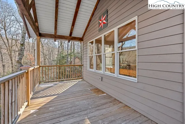 a house view with a wooden bench
