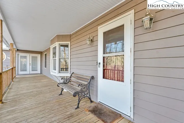 a view of a hallway view with wooden floor and furniture