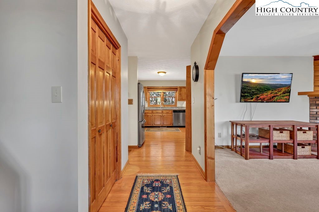 472 Virgil's Lane Boone, NC 28607 - Photo 10 of 44 a view of a hallway view with wooden floor and furniture