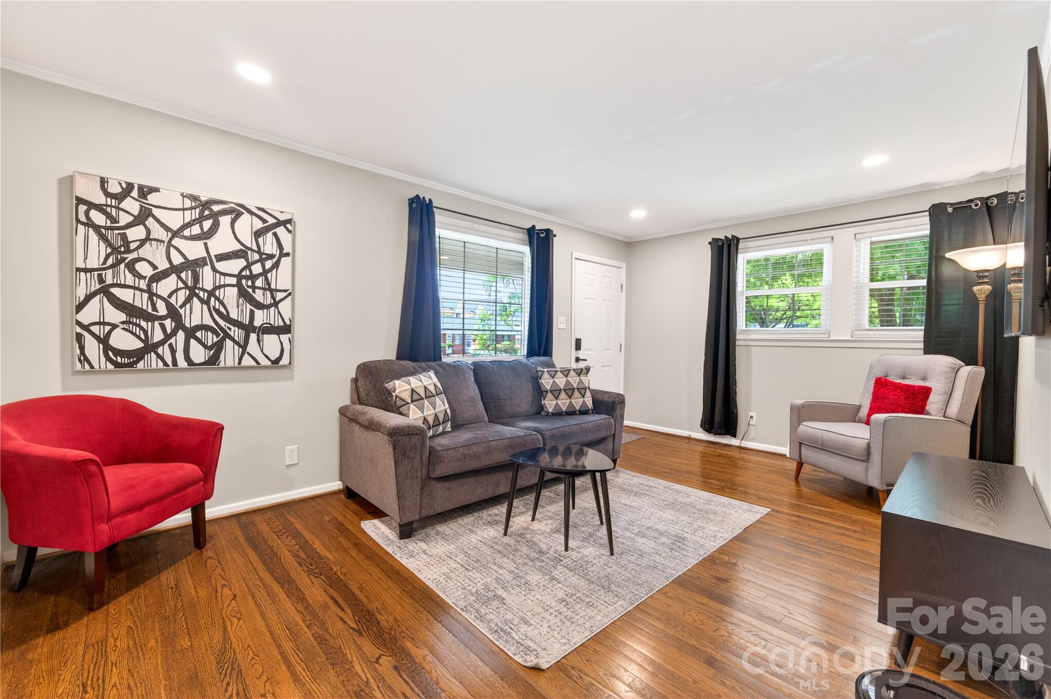 3241 Minnesota Road Charlotte, NC 28208 - Photo 7 of 18 a living room with furniture and a wooden floor
