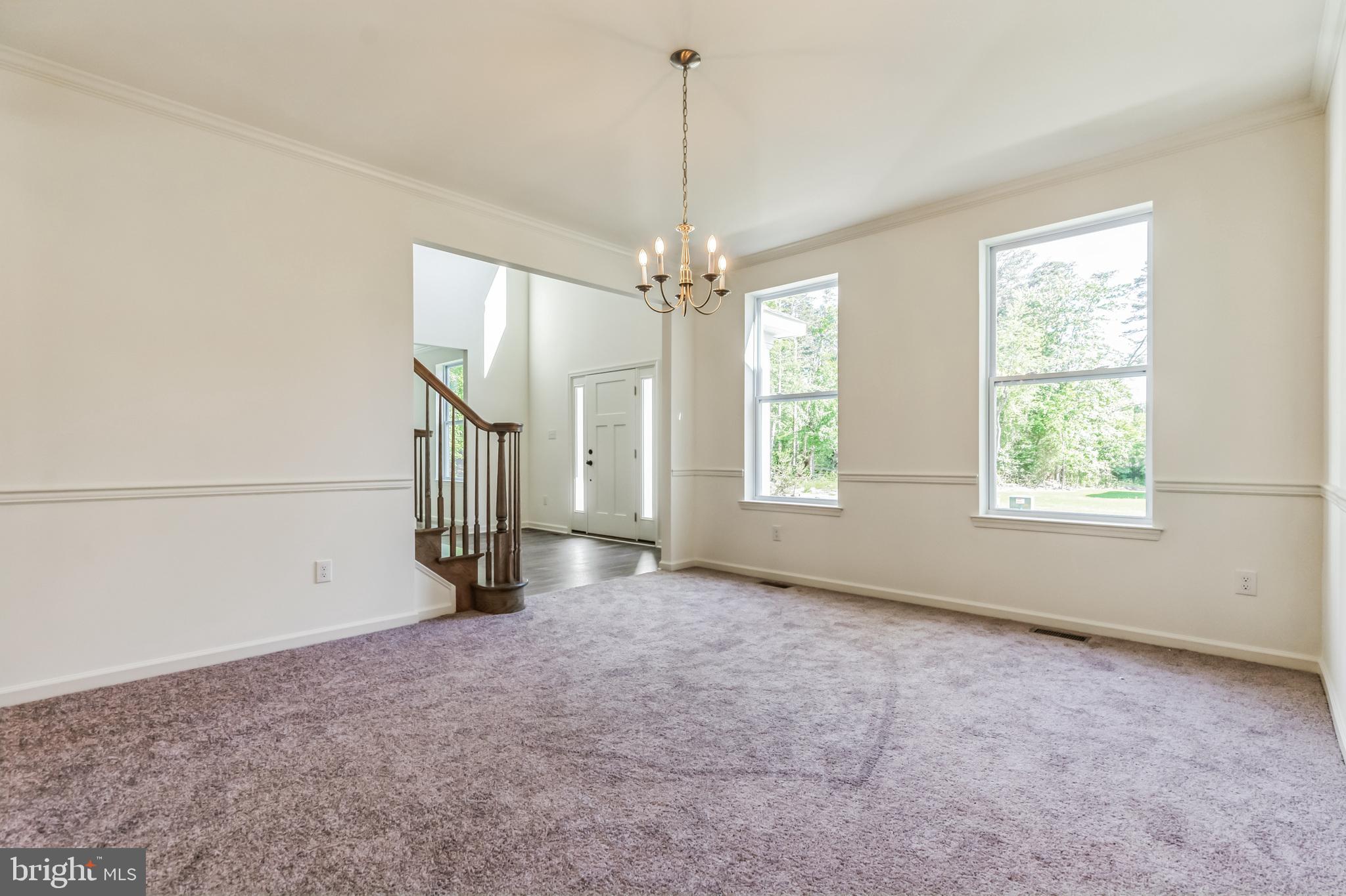 848 Saw Mill Road, Unit D Townsend, DE 19734 - Photo 12 of 53 an empty room with windows and entrance