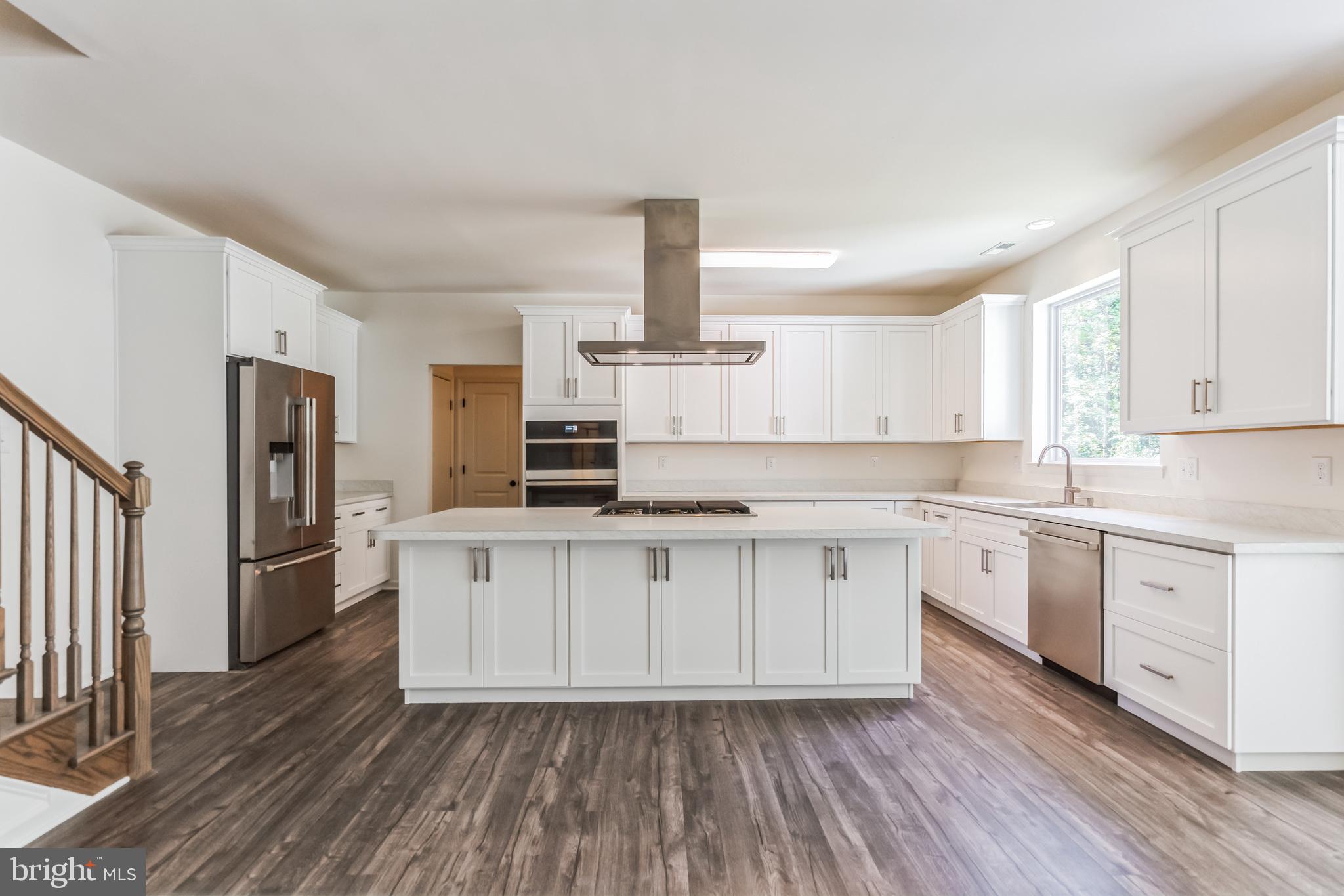848 Saw Mill Road, Unit D Townsend, DE 19734 - Photo 16 of 53 a kitchen with stainless steel appliances a refrigerator sink and cabinets