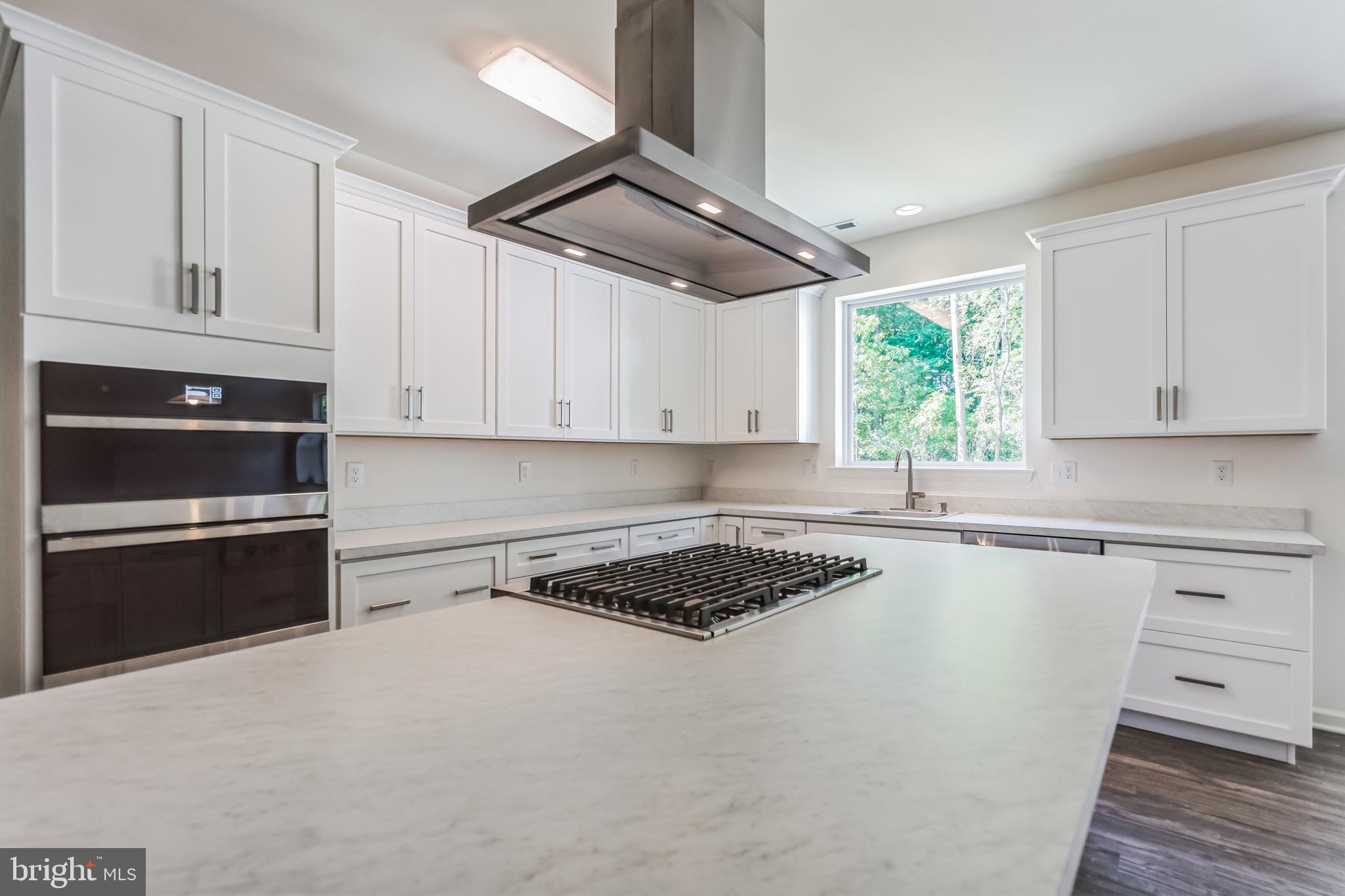 848 Saw Mill Road, Unit D Townsend, DE 19734 - Photo 19 of 53 a kitchen with cabinets appliances and a window