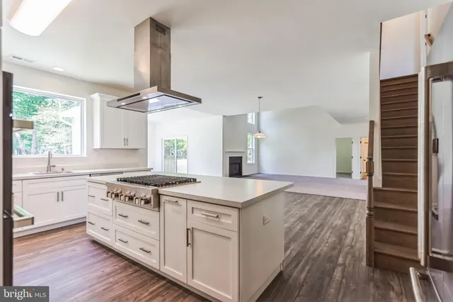 a kitchen with a stove oven and sink