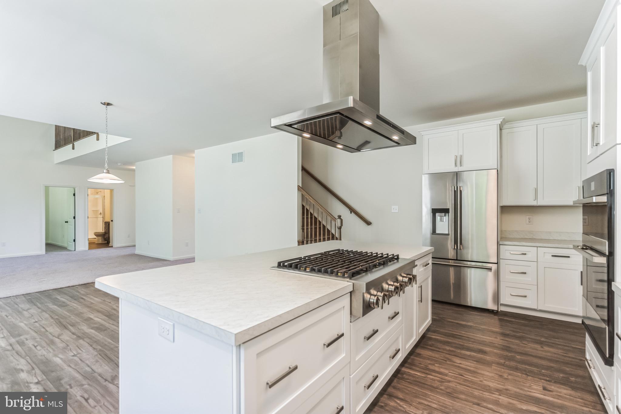 848 Saw Mill Road, Unit D Townsend, DE 19734 - Photo 21 of 53 a kitchen with a stove and a refrigerator