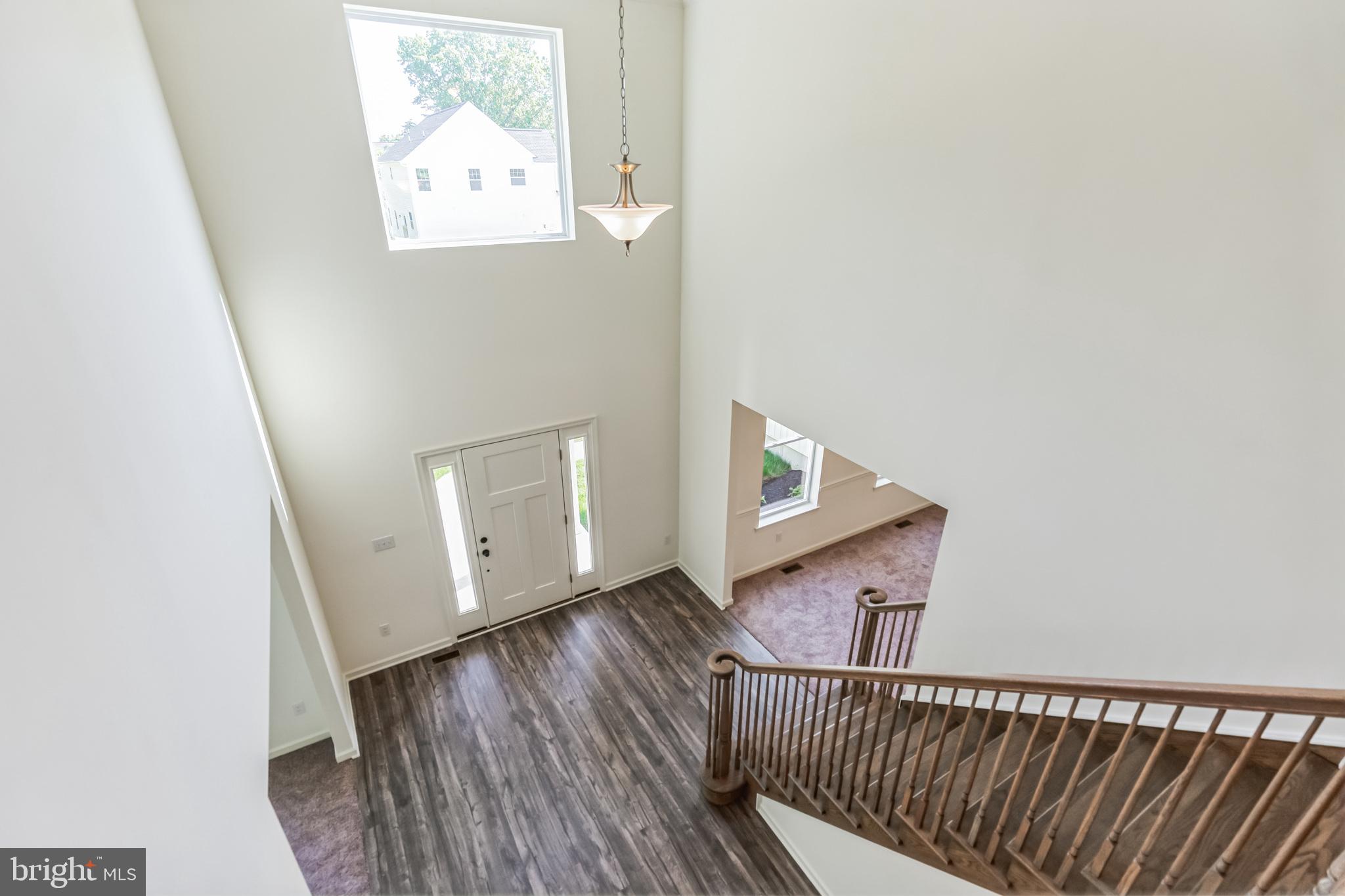 848 Saw Mill Road, Unit D Townsend, DE 19734 - Photo 28 of 53 an entryway with wooden floor