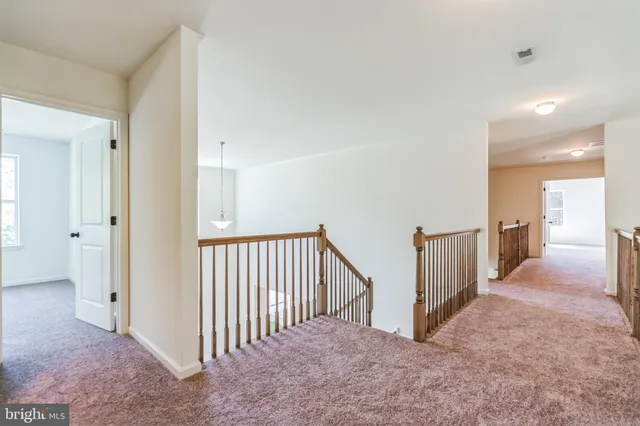 a view of a hallway with closet area
