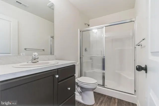 a bathroom with a sink mirror and window