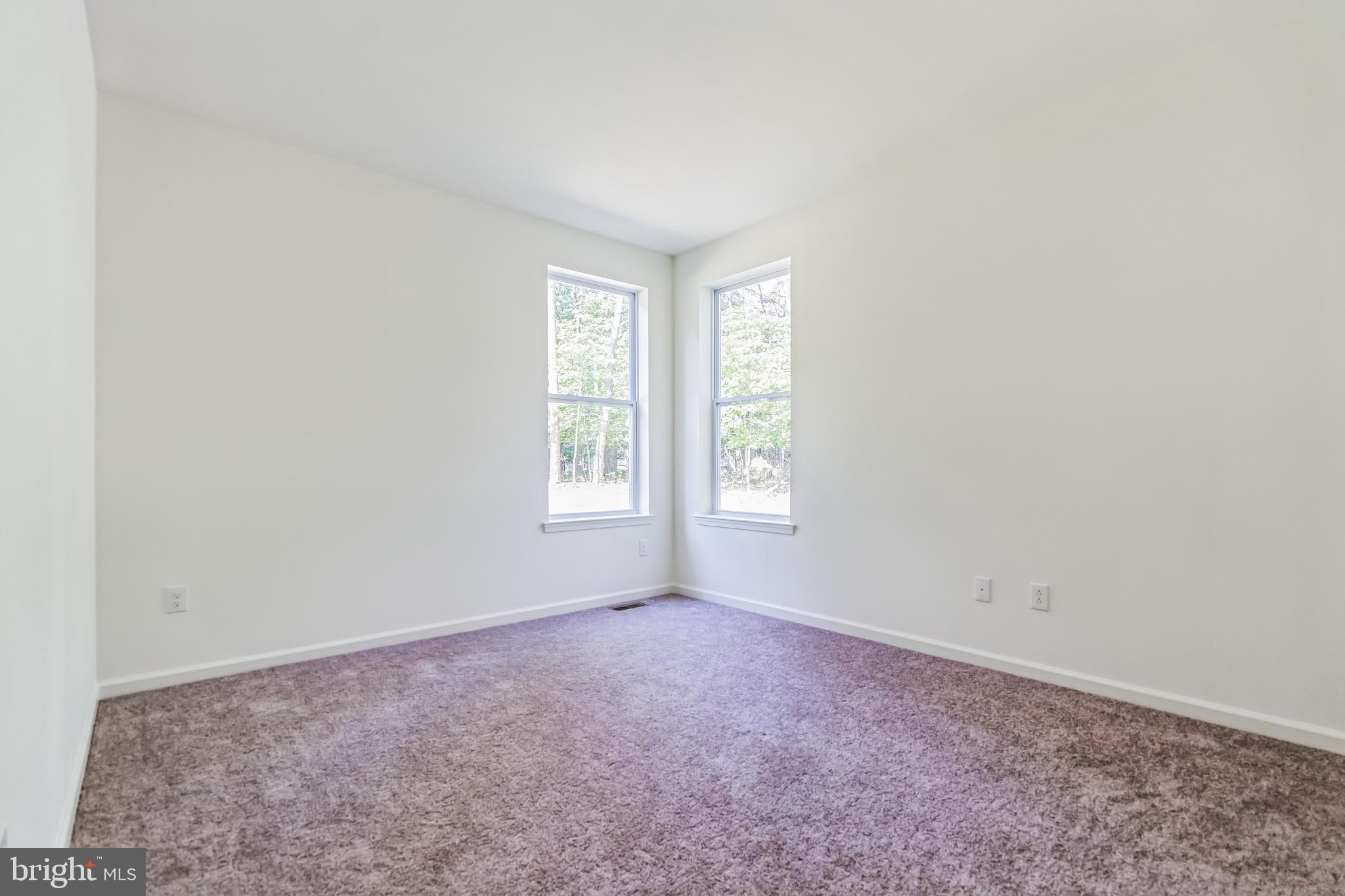 848 Saw Mill Road, Unit D Townsend, DE 19734 - Photo 41 of 53 an empty room with windows