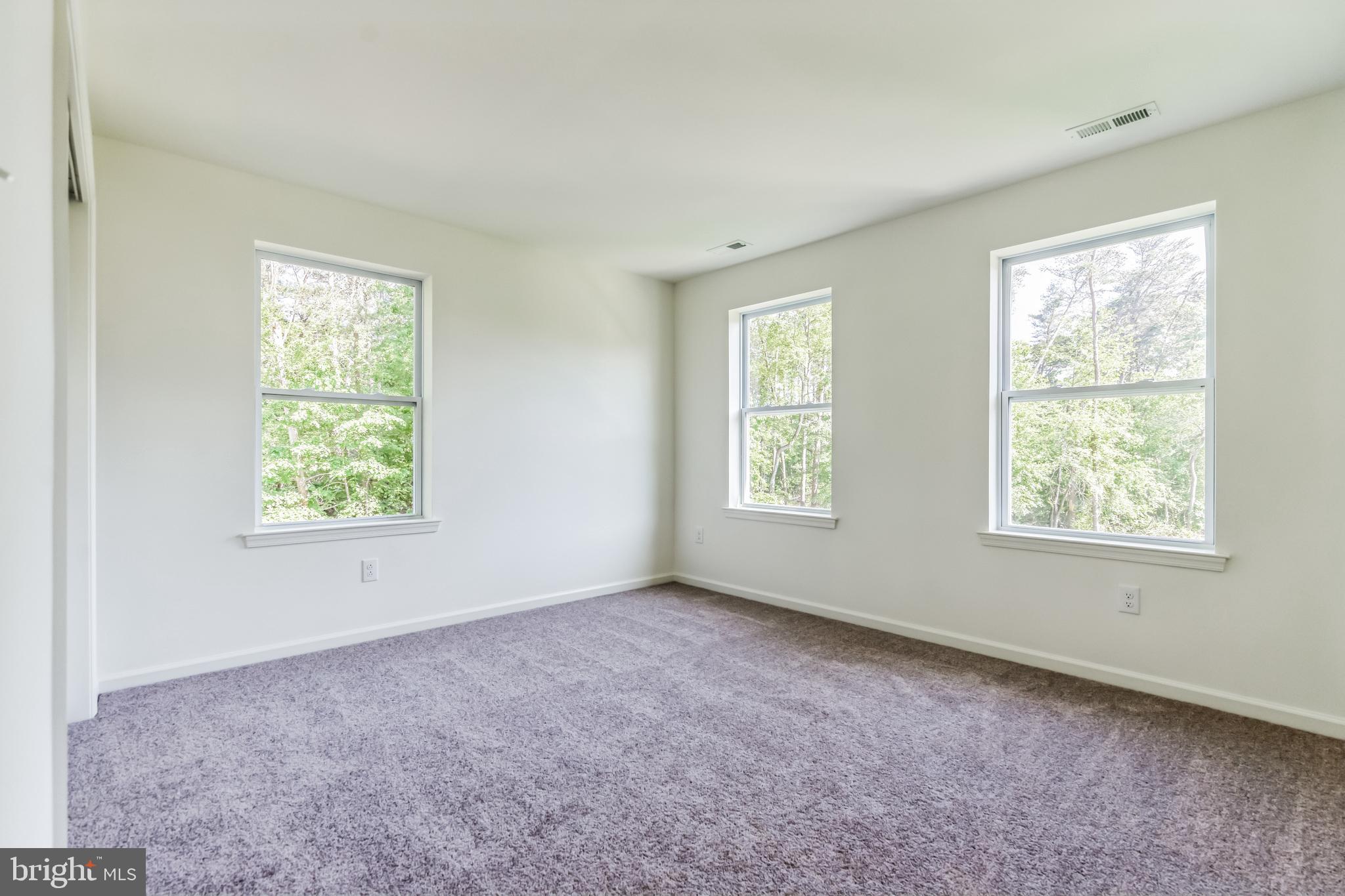848 Saw Mill Road, Unit D Townsend, DE 19734 - Photo 45 of 53 an empty room with windows