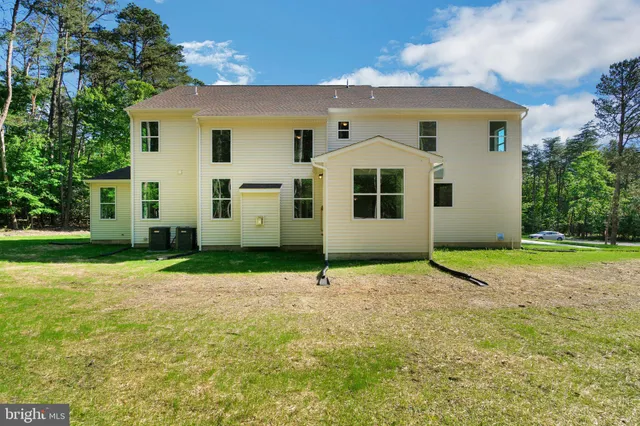 a house with yard in front of it